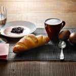 Breakfast is set with food and drink.