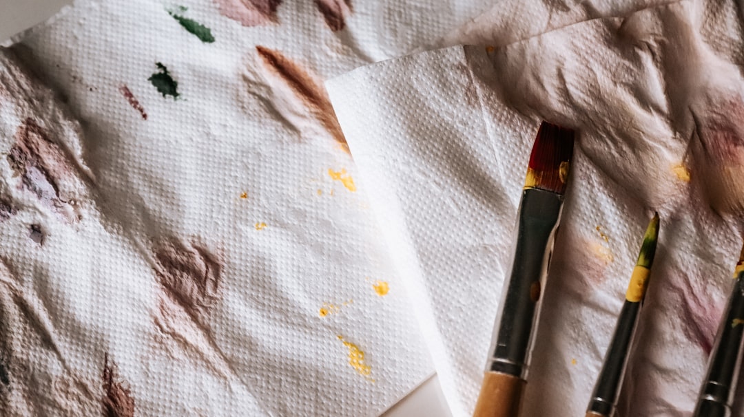black and brown makeup brush on white tissue paper